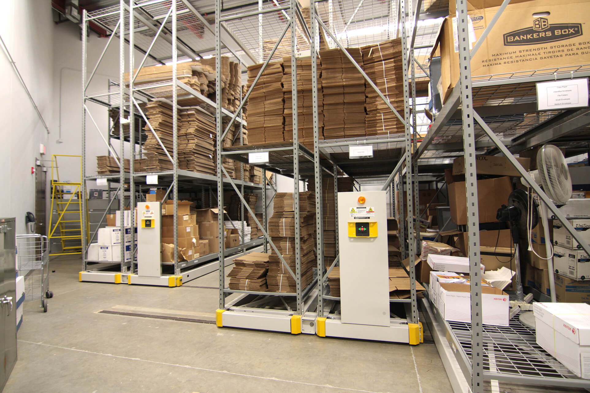 Wide span racking on compact mobile storage system in evidence room