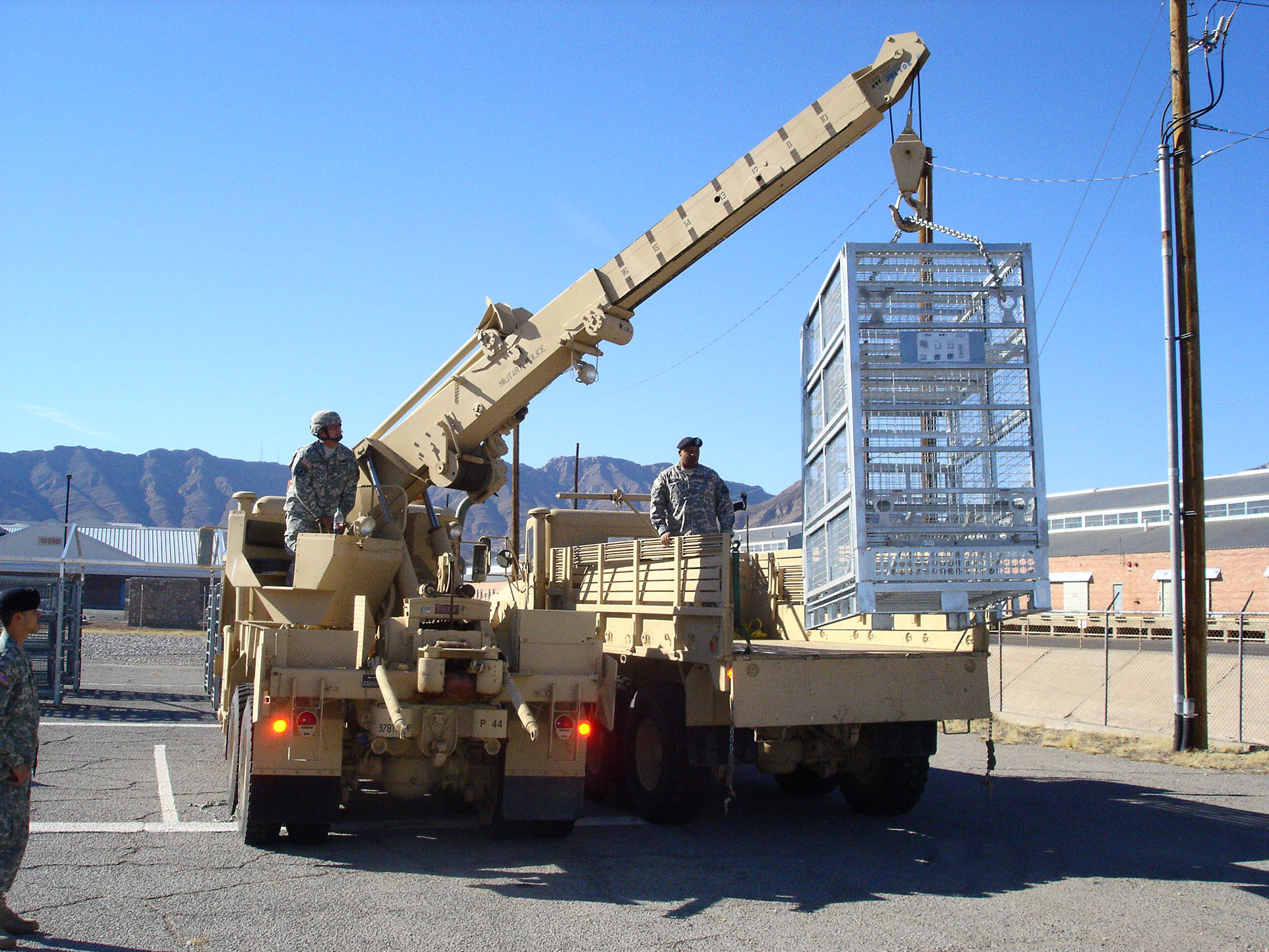 Deployable Military Container Being Sling-Loaded for Deployment